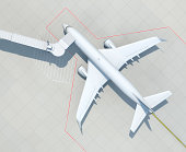 在机场有登机桥的飞机图片素材