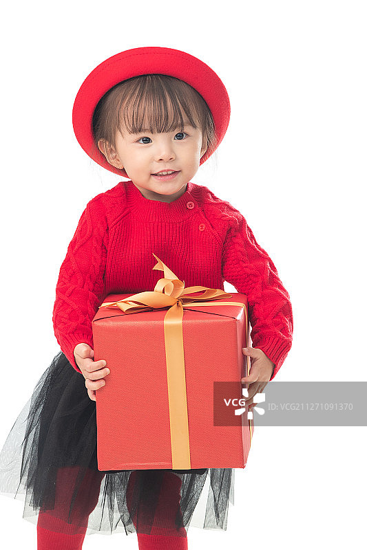 可爱的小女孩拿着新年礼物图片素材