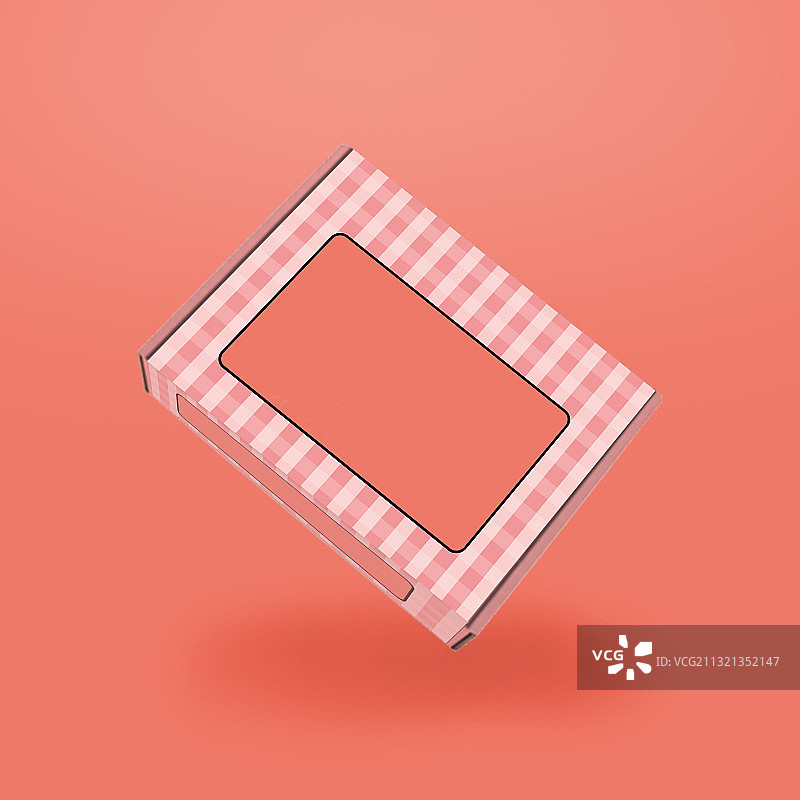 礼品盒的特写，以粉红色为背景图片素材