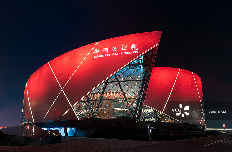 中国郑州大剧院铝板异形建筑玻璃幕墙夜景景观图片素材