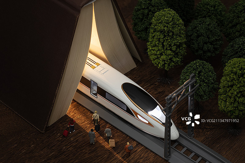 微缩创意夜晚书本隧道站台高铁动车组与旅客图片素材