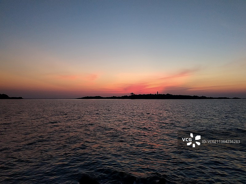橙色的蓝色，日落时大海对着天空的风景，Malpe，印度图片素材