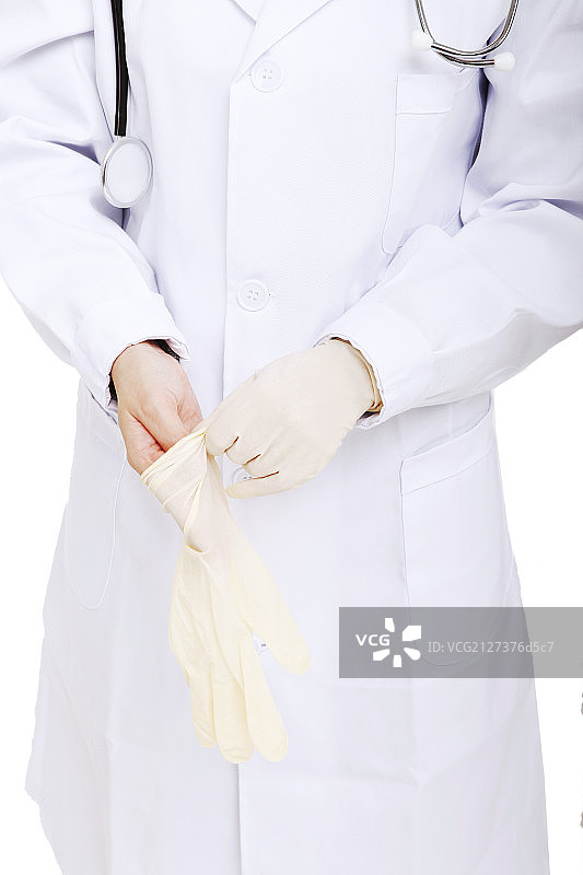 东方年轻女医生戴外科手套图片素材