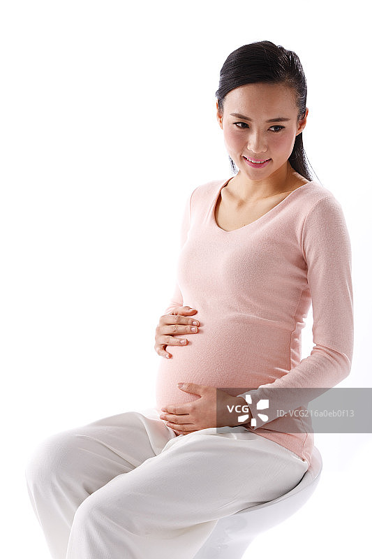 孕妇手放在肚子上图片素材