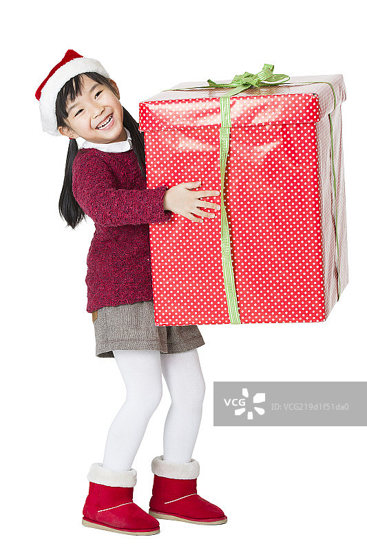 快乐的小女孩和圣诞礼物图片素材