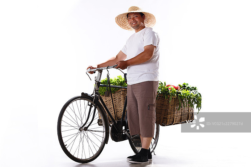 一个菜农推着自行车卖菜图片素材