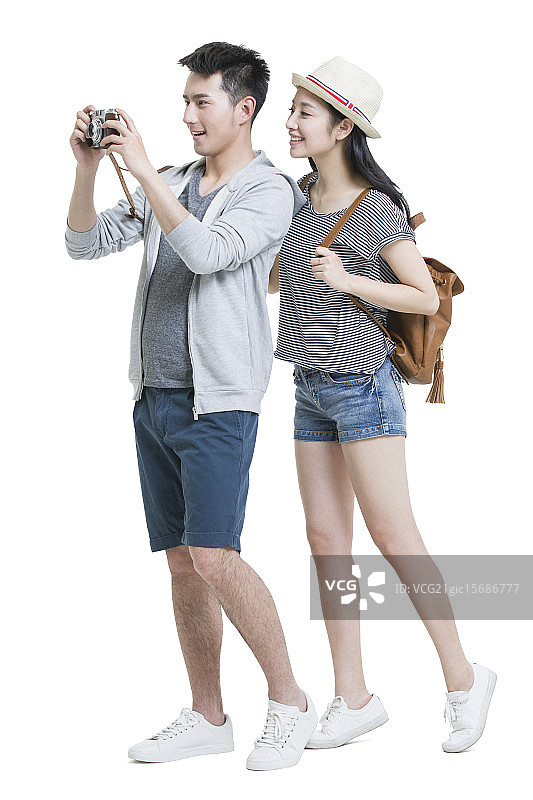 快乐情侣带着相机旅行图片素材