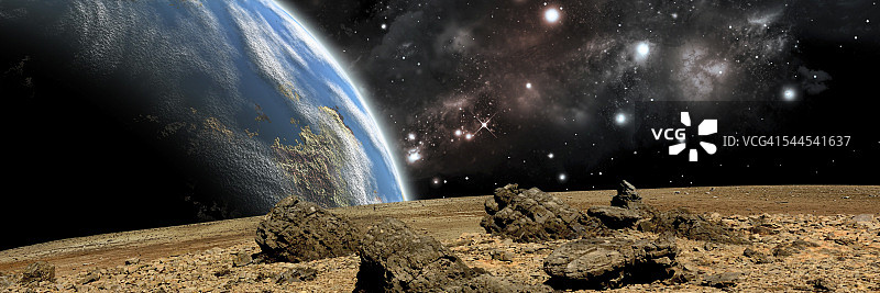 一颗类地行星升起在一个岩石和贫瘠的外星世界。图片素材
