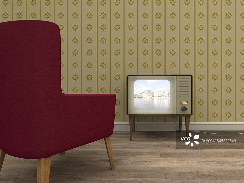 复古风格的客厅里有老式电视机和红色扶手椅图片素材