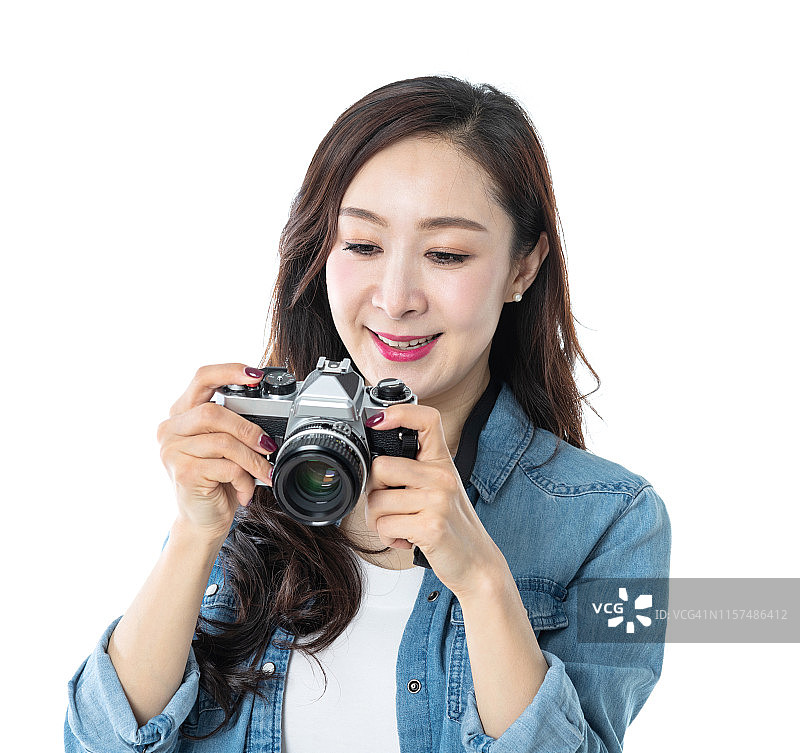 白色背景下的美女拿着单反相机图片素材