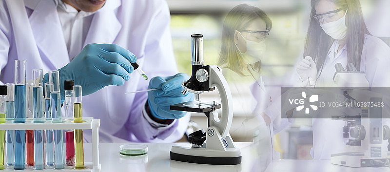 实验室概念;科学家们在实验室里使用显微镜来研究和开发技术。图片素材