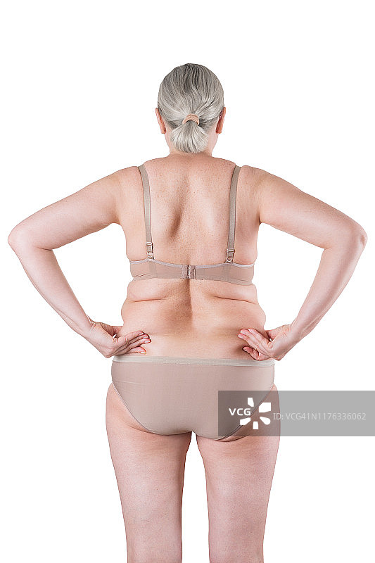 老胖女人孤立在白色的背景，超重的背部与皱褶的皮肤图片素材