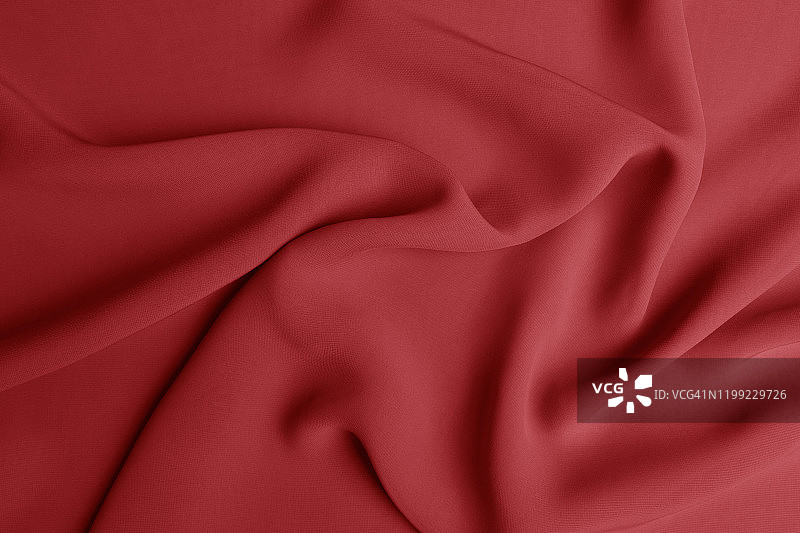 光滑典雅的红色丝绸或绸缎豪华布料质地可作为抽象的背景。奢华的情人节背景设计。图片素材
