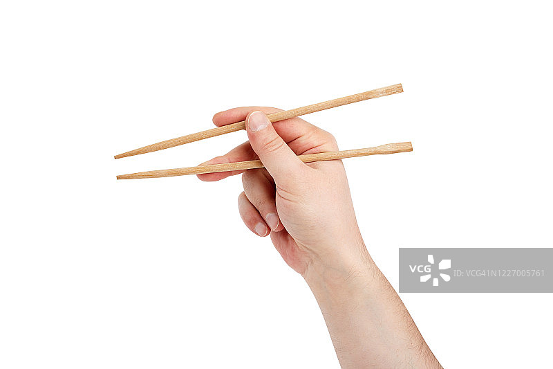 男子用筷子吃寿司，孤立在白色背景上图片素材