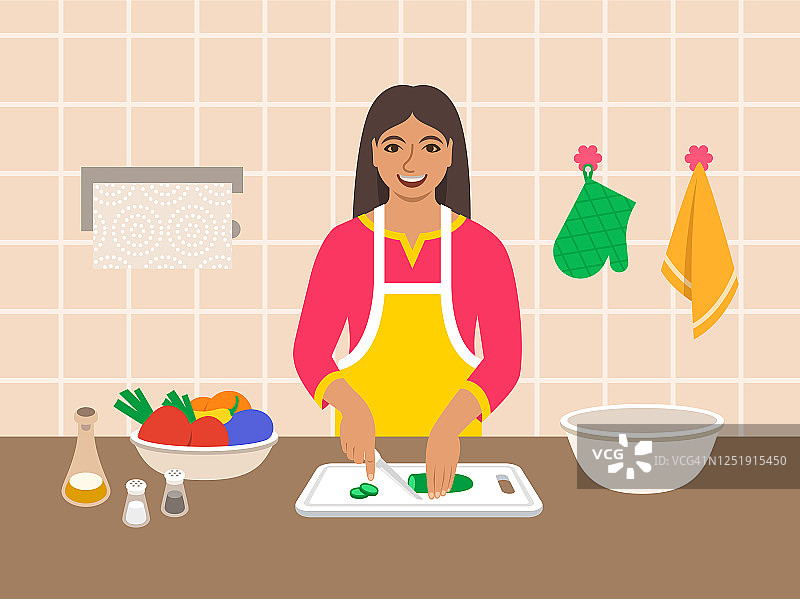 印度妇女在厨房切蔬菜做沙拉图片素材