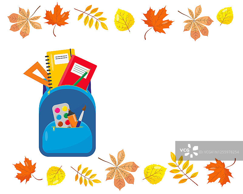 书包里装着秋季用品和树叶。图片素材