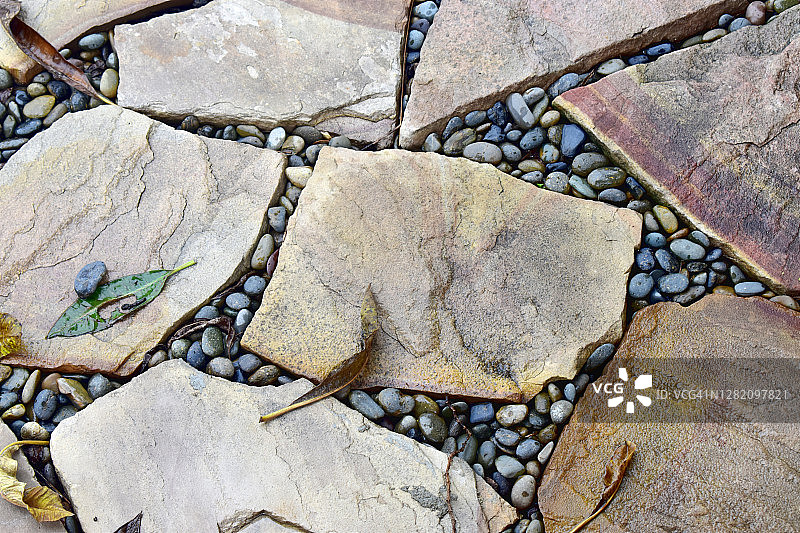 人行道街道的石头表面，抽象的背景图片素材