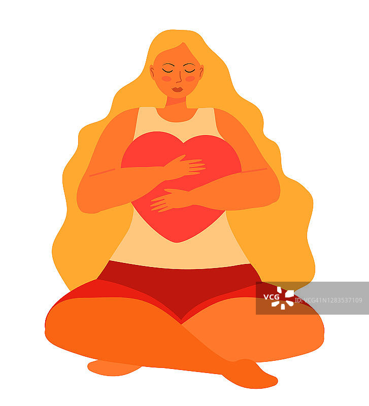 可爱的女人与长金发拥抱大心小心地坐在莲花位置瑜伽。女人手里拿着一颗红心。爱自己，自尊和身体的积极图片素材