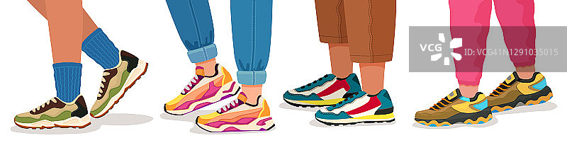 英尺运动鞋。女性和男性走路的腿在运动鞋与袜子，裤子和牛仔裤。时尚健身鞋矢概念图片素材