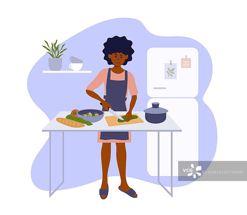 黑人妇女在小厨房烹饪健康的自制食物图片素材