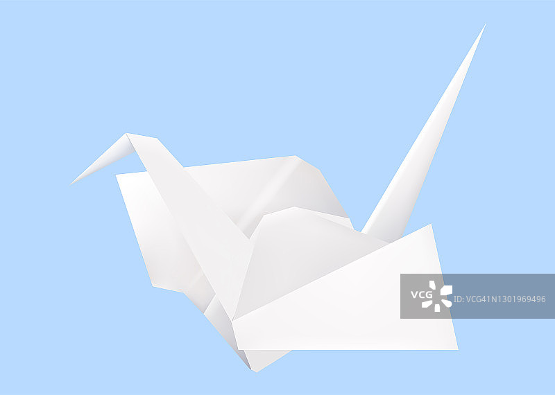 蓝色背景上的白色折纸鹤图片素材