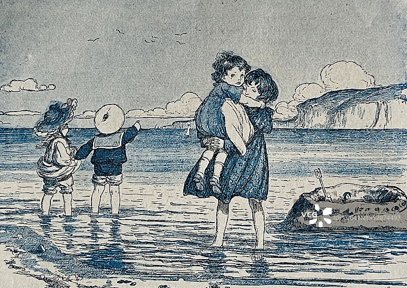 女孩在海滩上的沙堡图片素材