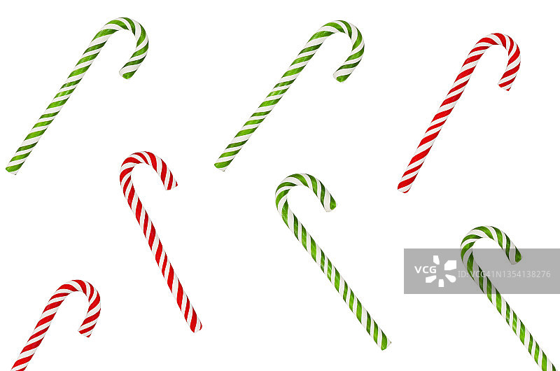圣诞糖果红色和绿色的棒棒糖孤立在白色的背景下，孩子节日糖果和款待图片素材