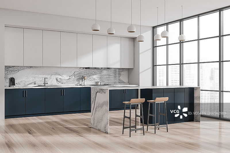 现代的白色和蓝色厨房。角落里的观点。图片素材