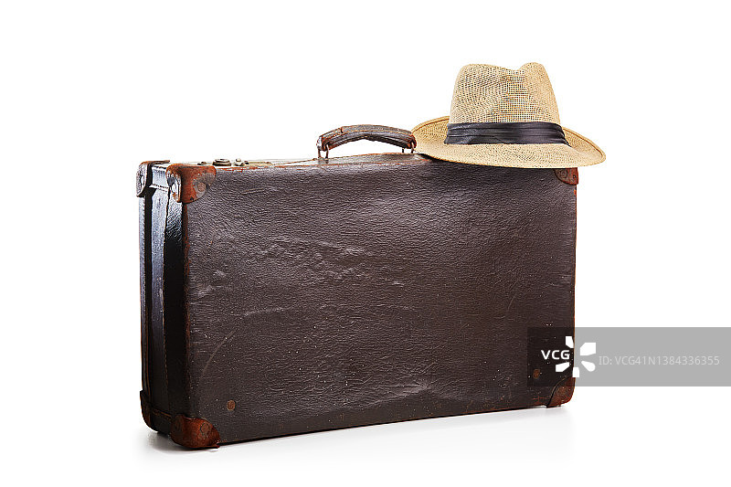 老式的老式棕色皮箱和白色的草帽。准备好旅行和度假图片素材