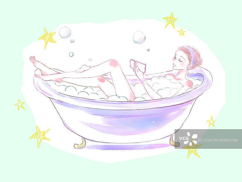 一个女人在浴缸里看智能手机图片素材