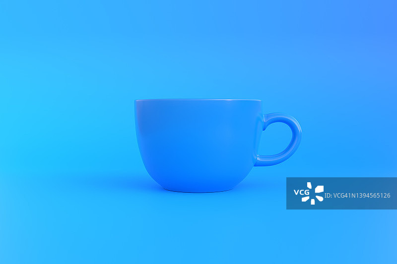 蓝色背景上的蓝色陶瓷咖啡杯图片素材