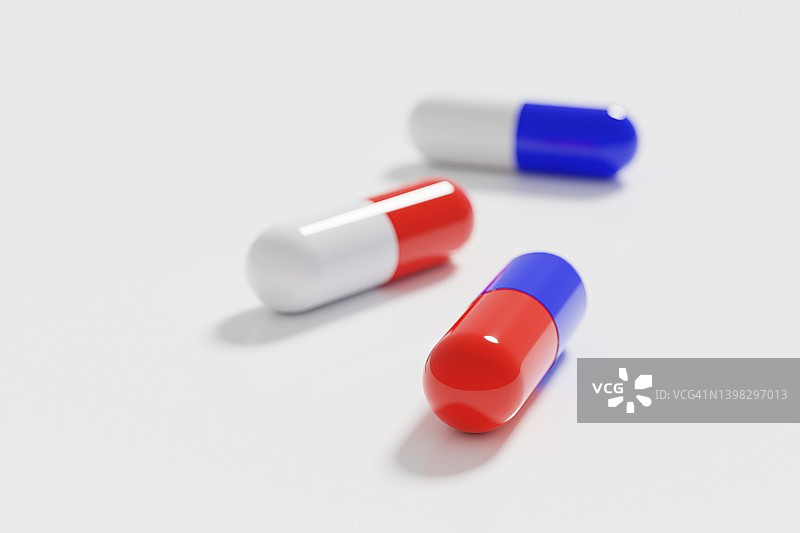 白色、红色和蓝色的药胶囊图片素材