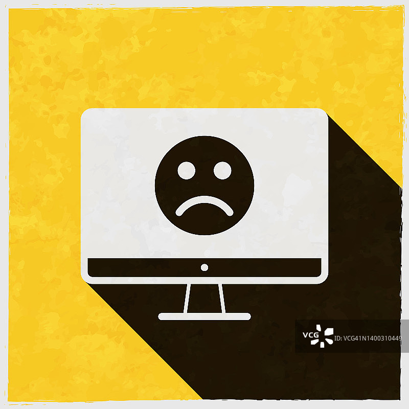 台式电脑上有悲伤的表情。图标与长阴影的纹理黄色背景图片素材