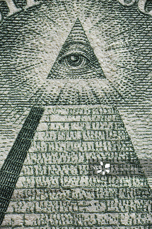 印在美元上的金字塔顶上的三角形眼睛图片素材