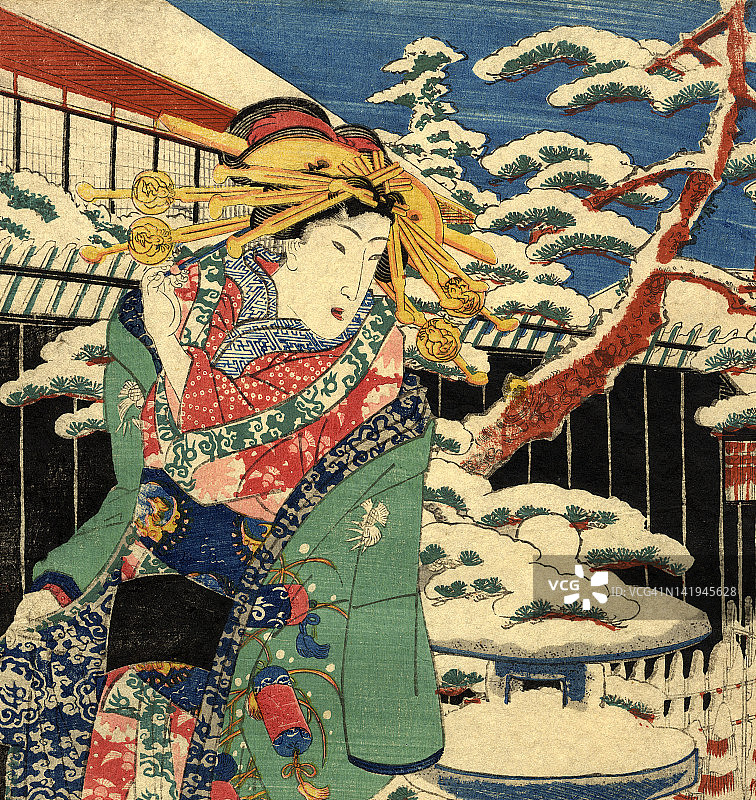传统的日本木刻女在雪中图片素材