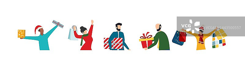 快乐的人们有圣诞礼物。一套快乐的男人和女人拿着和携带包装好的新年礼物盒。寒假礼品盒。图片素材