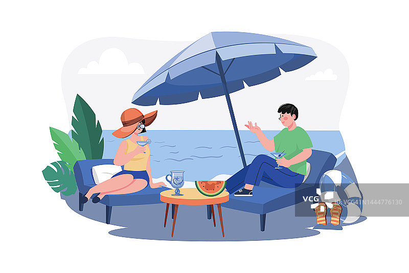 男人和女人躺在海滩休息室喝鸡尾酒图片素材