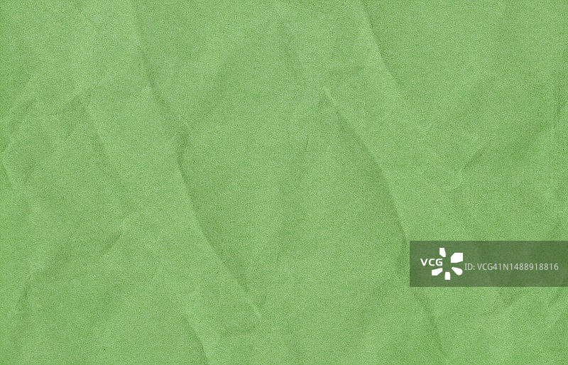 绿色皱纸背景。绿色质朴的质地。高质量的纹理在极高的分辨率。绿色垃圾材料。纹理背景。剪贴簿图片素材