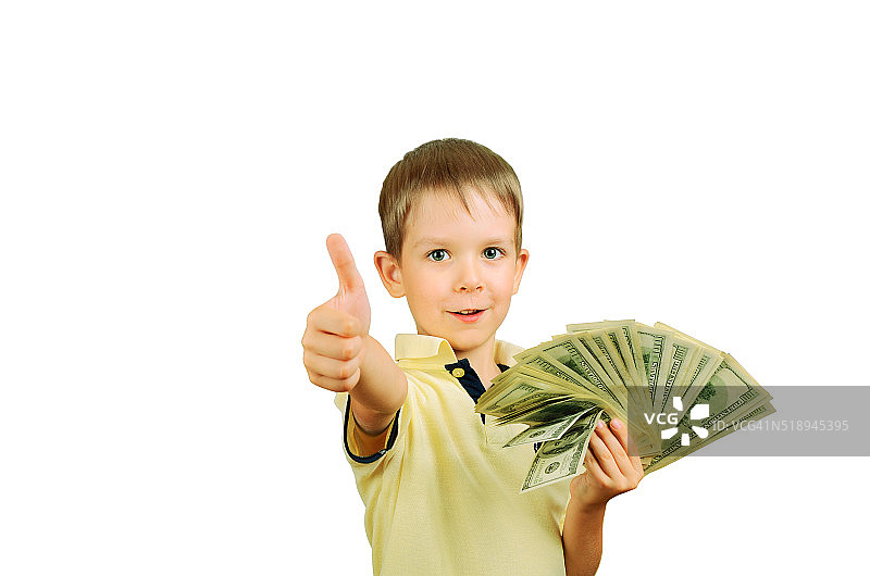 一个微笑的小男孩拿着一叠100美元的钞票图片素材
