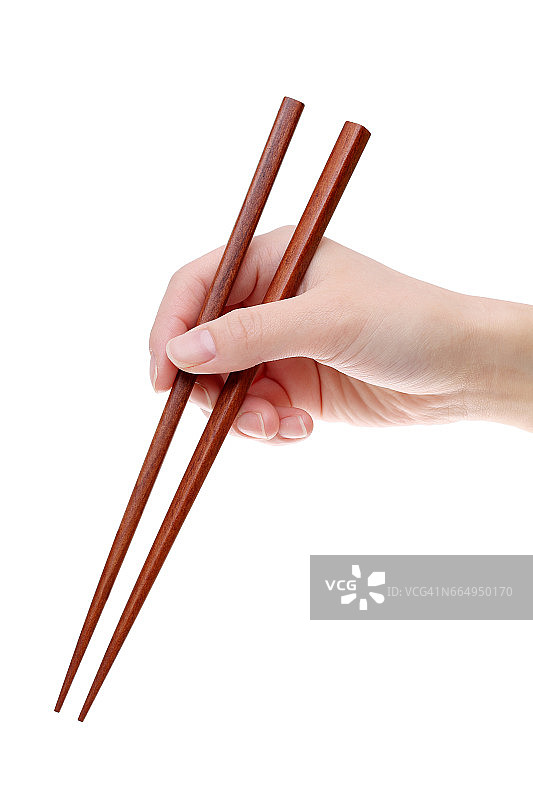 手握木筷子图片素材
