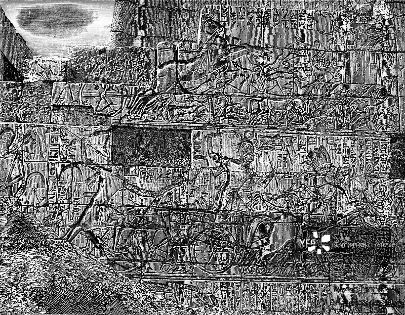 19世纪在埃及神庙雕刻的象形文字，描绘了第一集殴打利比亚人;维多利亚时代的埃及，文物和废墟，1890图片素材