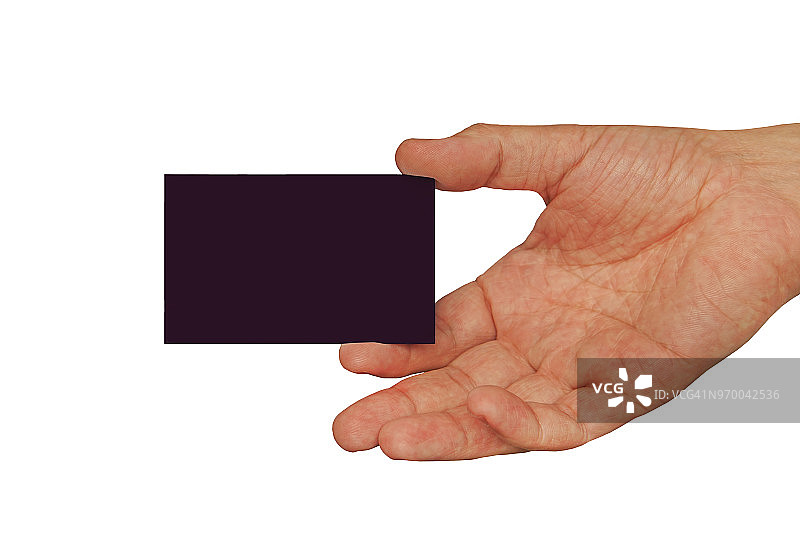 手握空白名片，深棕色名片在男性手中孤立在白色背景上图片素材