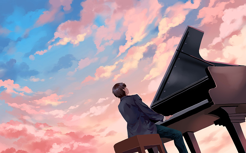 日落天空下的钢琴演奏图片素材