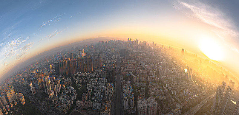 航拍城市上空的全景日出图片素材
