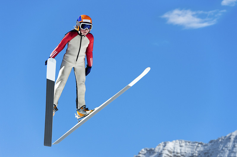 年轻的跳台滑雪在半空中对着蓝天图片下载