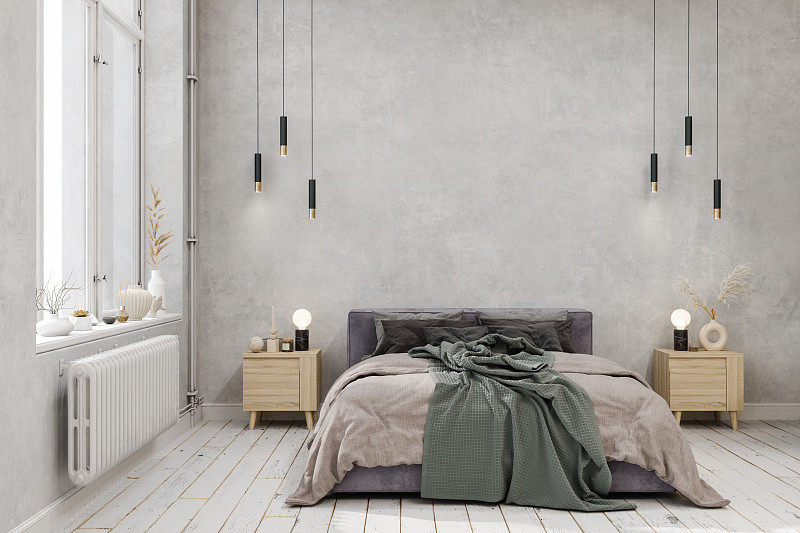 卧室内部与绿色毯子在床上，吊灯，拼花地板和灰色墙壁背景图片下载
