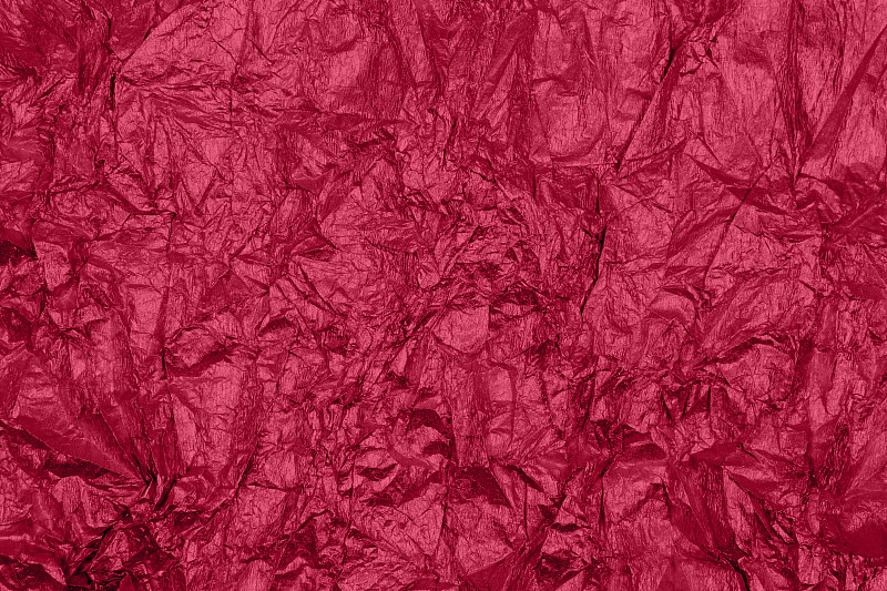 2023年的潮流viva洋红色背景与不均匀的表面。图片下载