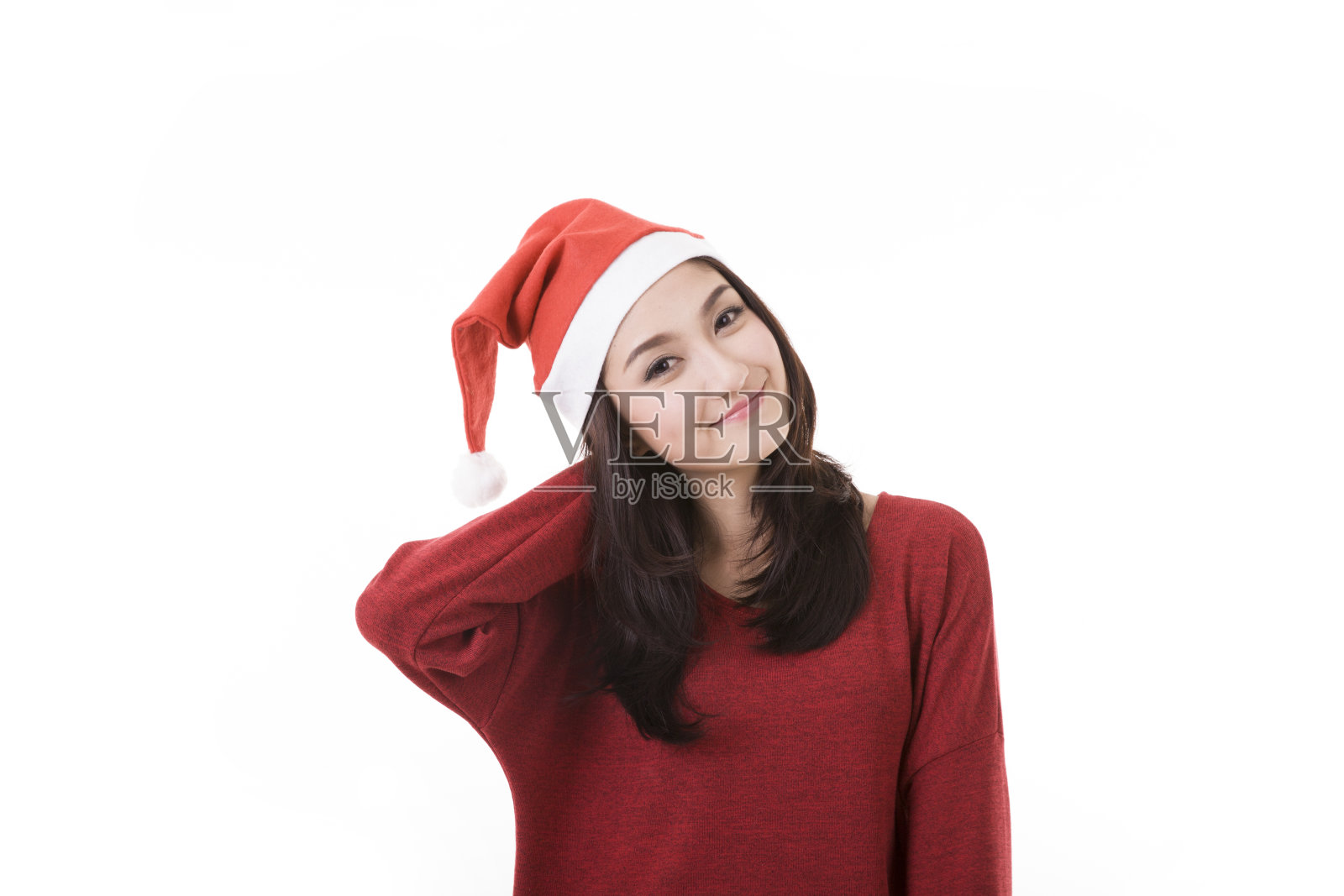 戴着圣诞老人帽的女人开心地微笑着照片摄影图片
