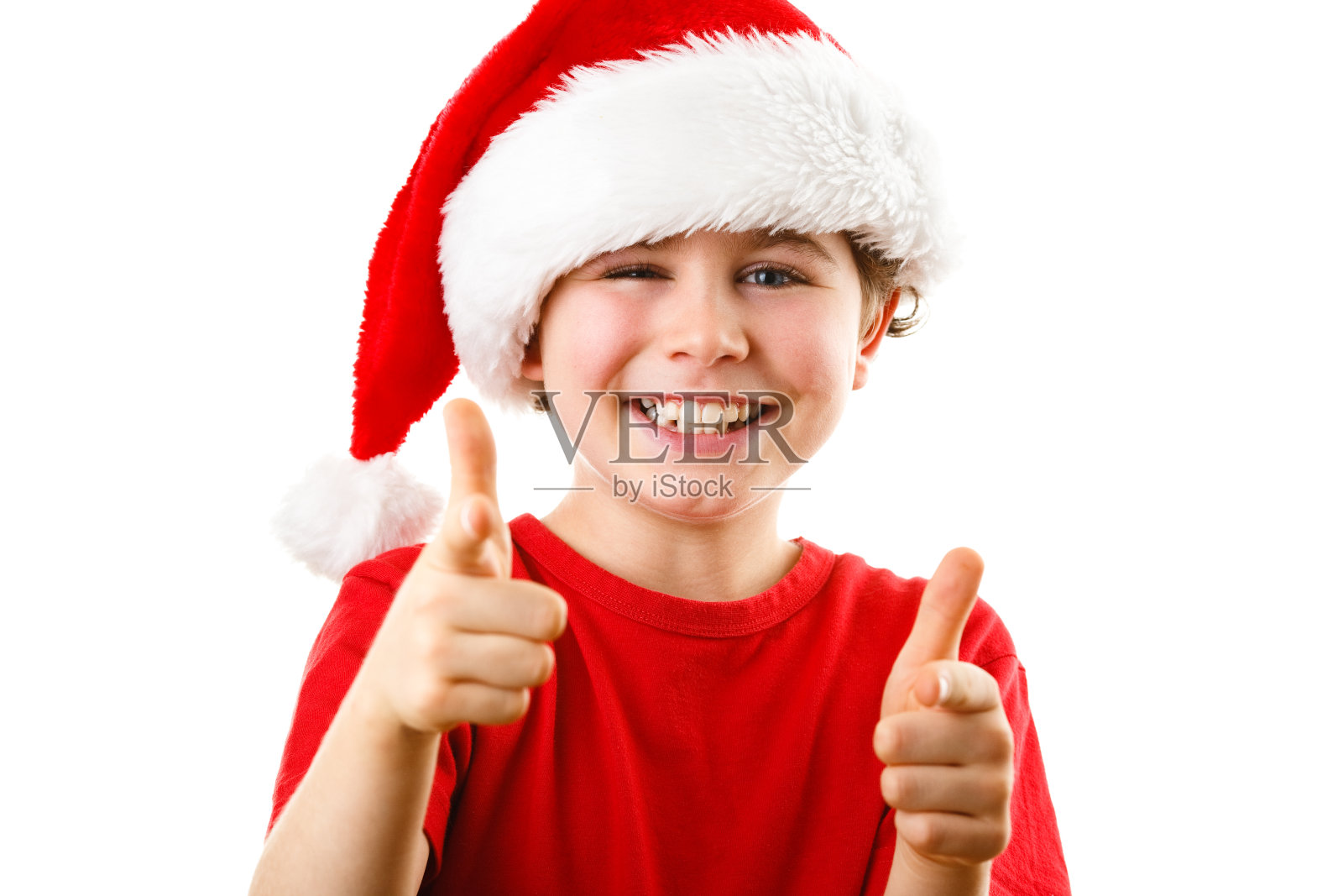 圣诞时间-男孩与圣诞老人的帽子照片摄影图片