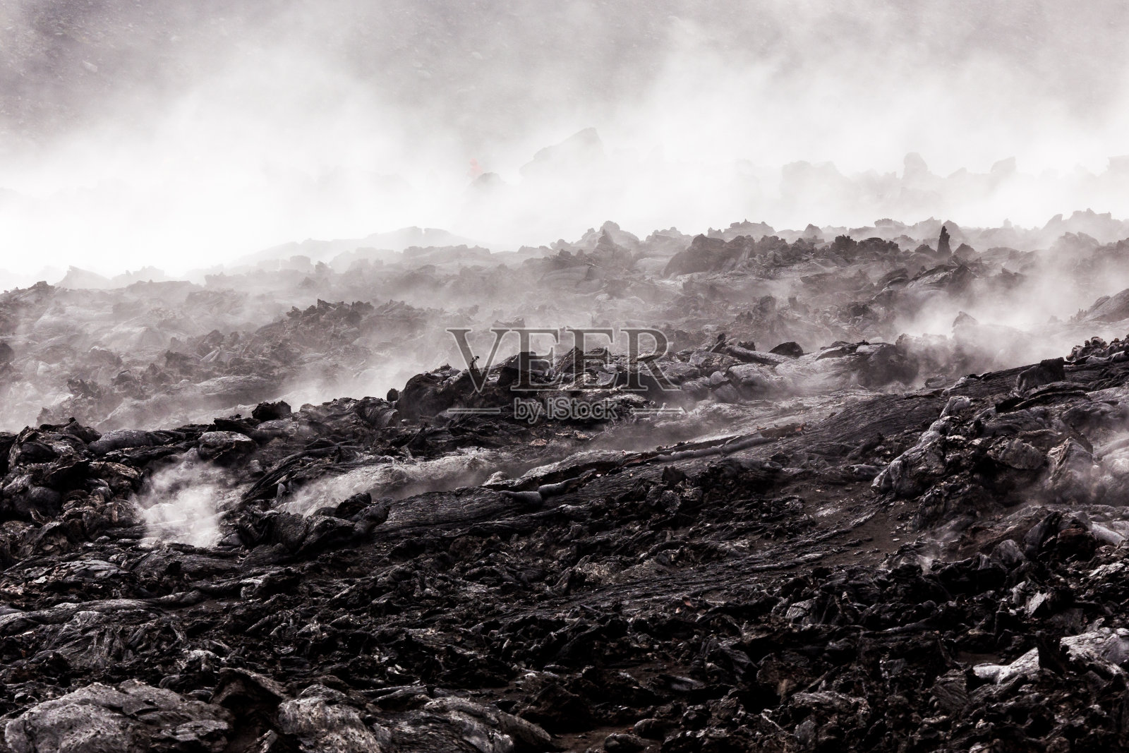 国家公园火山冒烟的熔岩田照片摄影图片
